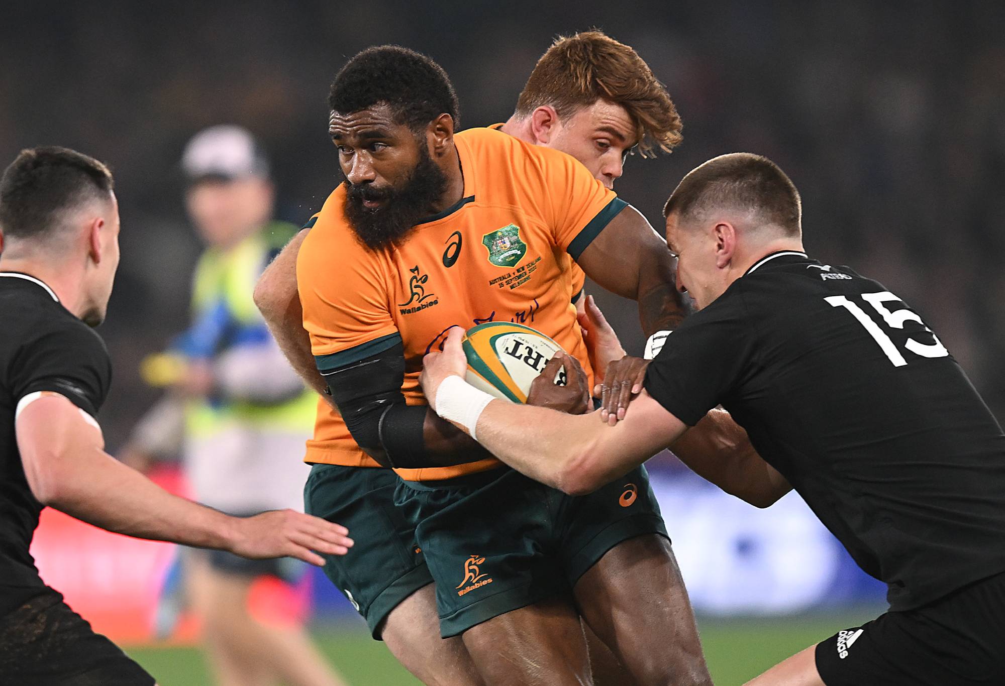Marika Koroibete of the Wallabies is tackled during The Rugby Championship & Bledisloe Cup match between the Australia Wallabies and the New Zealand All Blacks at Marvel Stadium on September 15, 2022 in Melbourne, Australia. (Photo by Morgan Hancock/Getty Images)