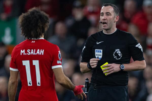 LIVERPOOL, ENGLAND - Saturday, December 23, 2023: Referee Chris Kavanagh shows a yellow card to Liverpool's Mohamed Salah during the FA Premier League match between Liverpool FC and Arsenal FC at Anfield. (Photo by David Rawcliffe/Propaganda)